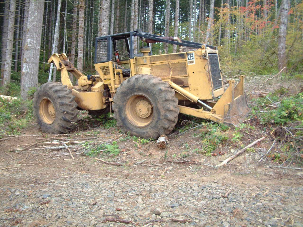 Cat 528 log Skidder with Esco Swing Grapple